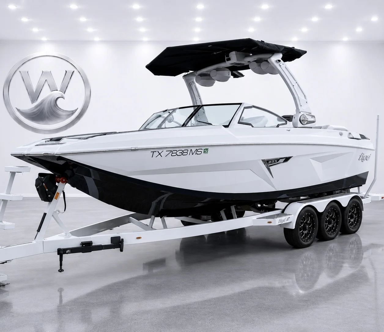 White Tige 23ZX on a trailer in a bright showroom